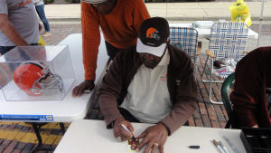 Leroy Kelly signing his rookie card for me with Ernie Green looking over his shoulder